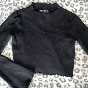 Black flared long sleeved crop-top